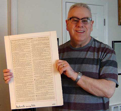Frank DeFreitas holding his John Baskerville Bible page printed in Cambridge, England in 1763.