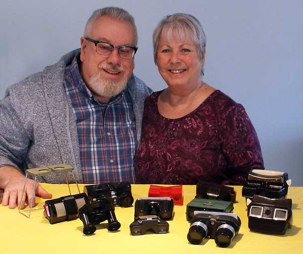 The author with his wife and collection of 20th century stereoscopes.