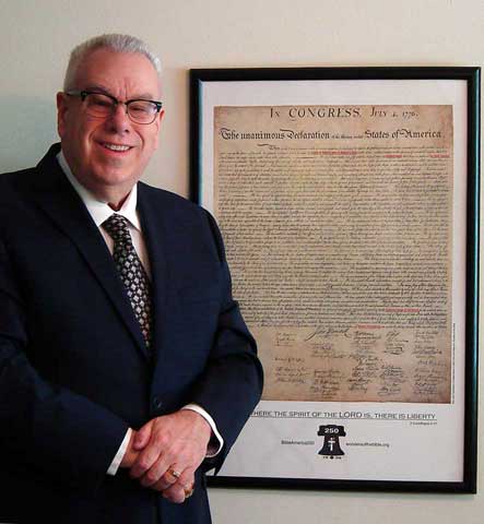 Frank DeFreitas with his Semiquincentennial Declaration of Independence edition.