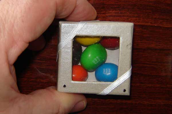 The author's laser candy box. The clear, see-through cover is actually encoded using invisible laser holographic information.
